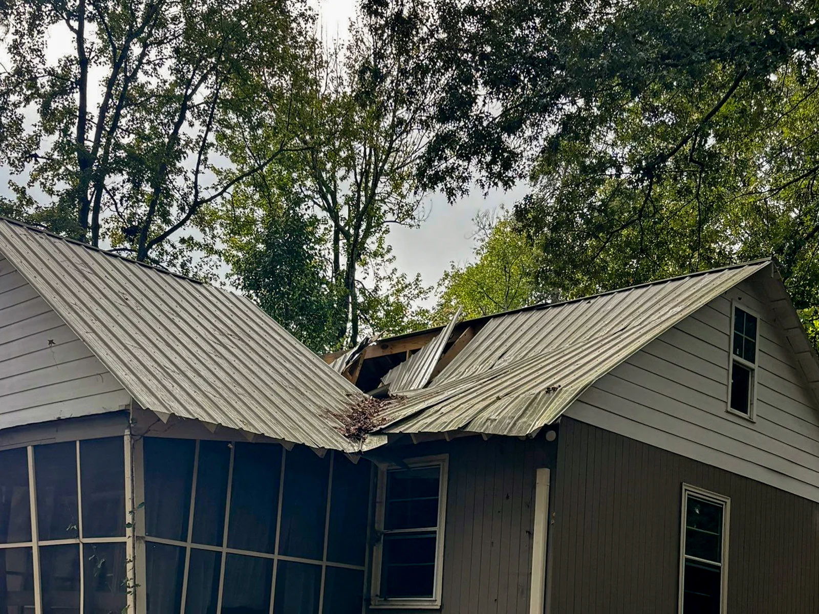 Storm damaged home requiring repairs and rebuild support